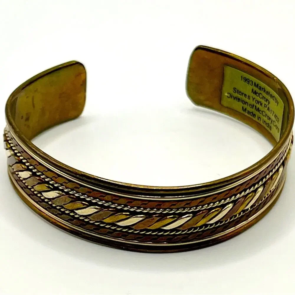 1993 brass and silver McCrory Stores cuff bracelet